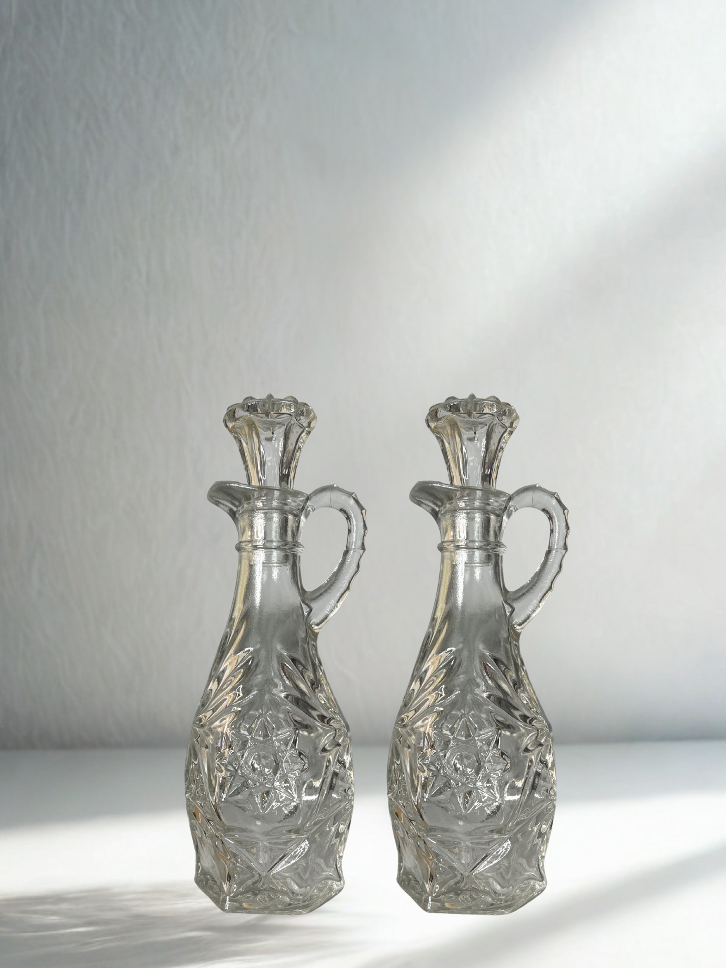 Set of 2 Vintage Pressed Glass Cruets with Stoppers – Starburst Pattern